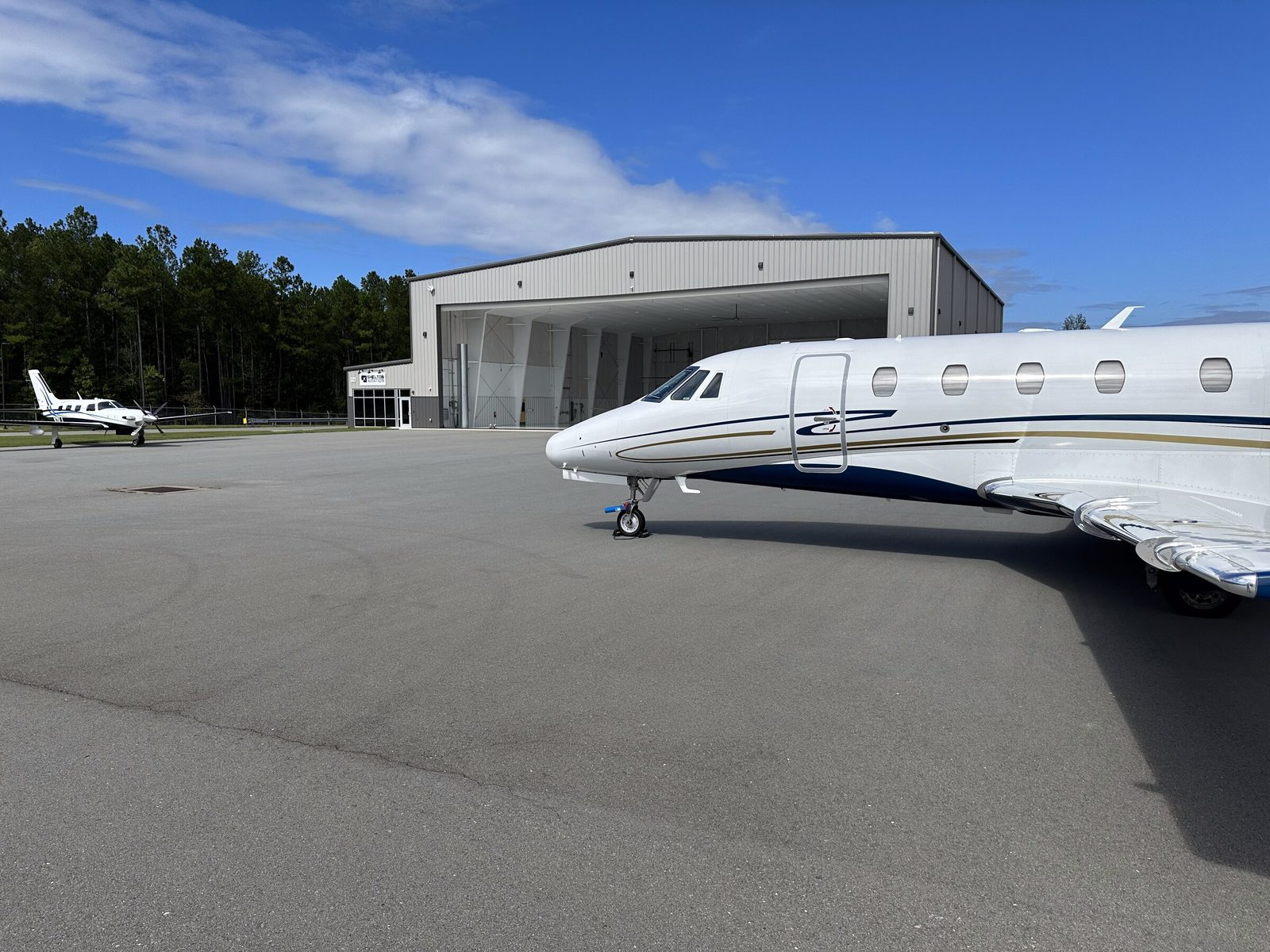 A Citation on the ramp in front of the hangar